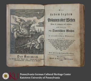 Old book with German lettering, and an engraving of a seven headed dragon.